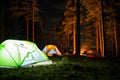 Person sitting in ultralight camping chair outdoors