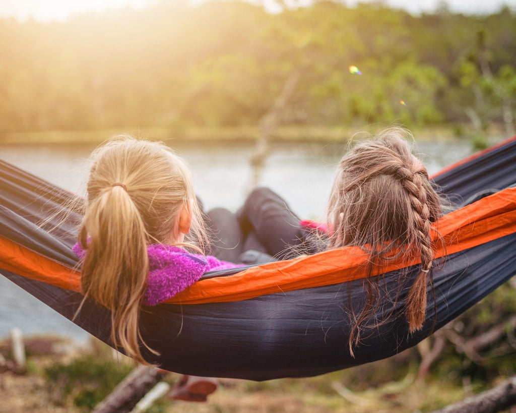 Camping hammock set up outdoors in nature