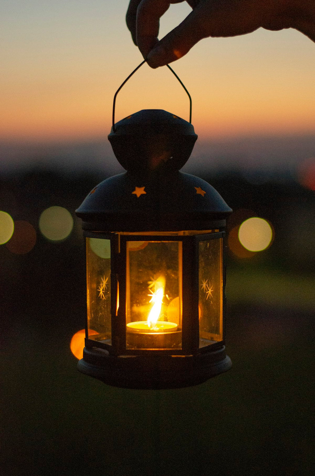 Lantern lighting up campsite in the dark